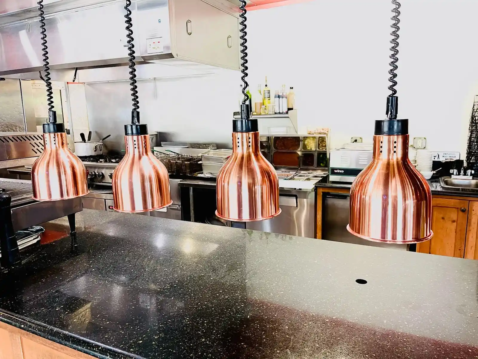 Joe's Kitchen, Bar, & Bakery kitchen with copper heat lamps, Alabaster Alabama